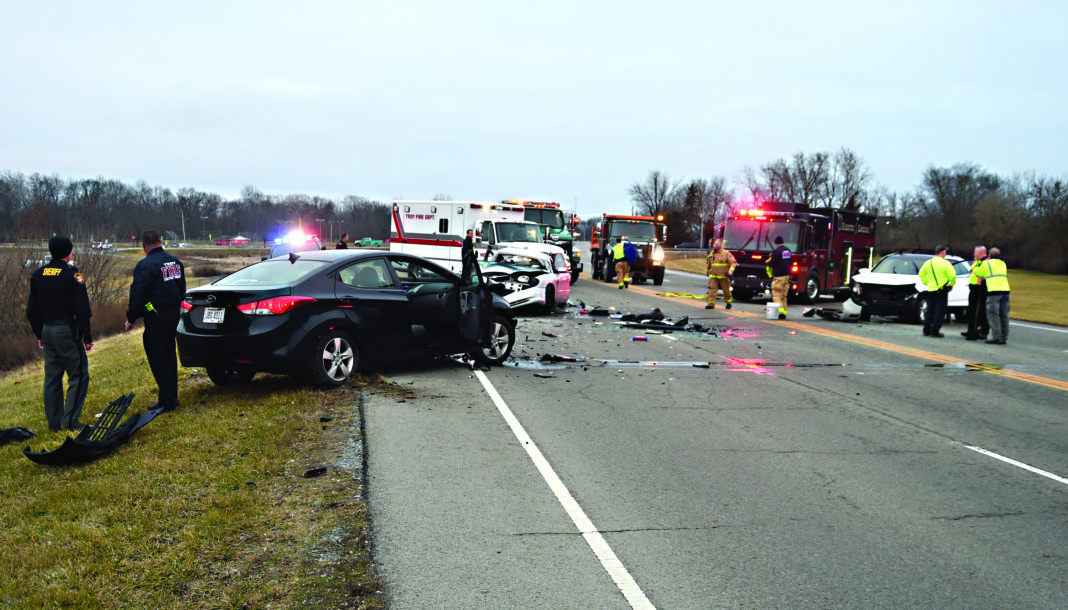 Mike Ullery | Miami Valley Today Multiple agencies work the scene of a three-vehicle crash on County Road 25-A just north of Eldean Road on Wednesday morning.